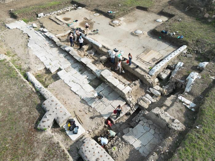 Drone view of the excavation of the two footpaths lining the street separating the basilica (top) from the theatre (bottom).