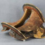 Scientists uncovered a elegantly carved saddle made from several pieces of birch wood from an ancient cave in Mongolia.