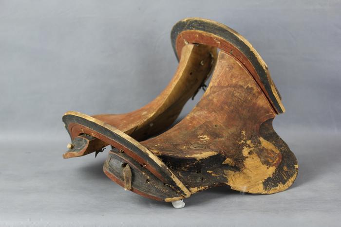 Scientists uncovered a elegantly carved saddle made from several pieces of birch wood from an ancient cave in Mongolia.