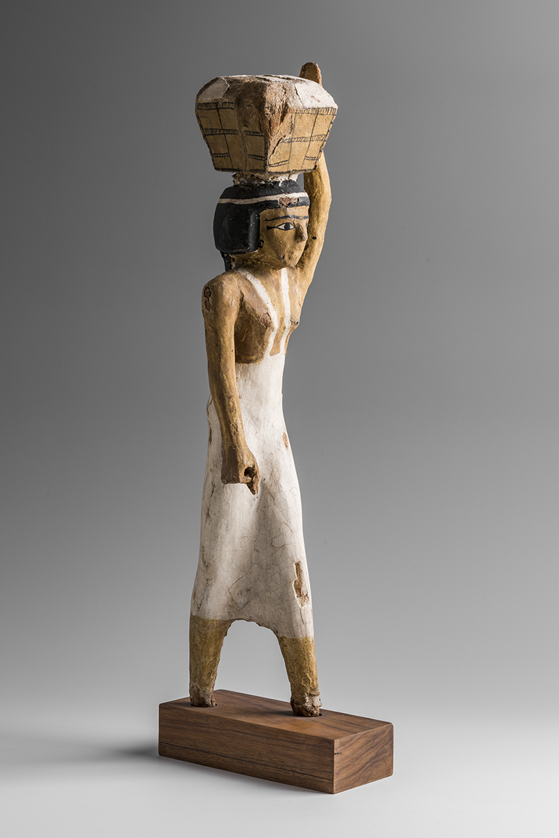Statuetta di portatrice di offerte. Primo Periodo Intermedio – Medio Regno (2118-1759 a.C.)