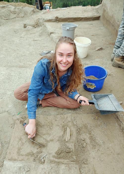 University of Alaska Fairbanks Ph.D. student Audrey Rowe works on a project near the Swan Point archaeological site, where a mammoth tusk she studied was found. Credits: Photo by Matthew Wooller