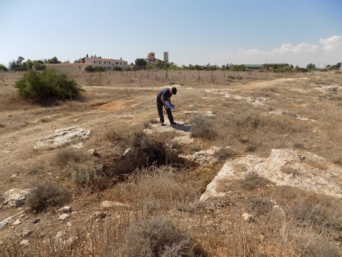 ULAS Archaeologist Matt Beamish recording a probable Byzantine period tomb near Xylotymbou. Credits: © ULAS, University of Leicester