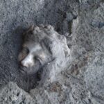 villa Nola Augustus A face from history. A haunting sight at the archaeological site. The face of a statue of the god Dionysus as it’s painstakingly chipped away from and brushed free of millennia of built-up deposits. ©2024 Institute for Advanced Global Studies CC-BY-ND