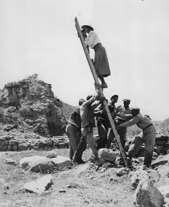 University of Cincinnati archaeologist Marion Rawson gets some help from workers to take video of Troy from atop a ladder. Credits: UC Classics