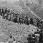 Visitors to Troy listen to a lecture about the University of Cincinnati's excavations in 1934. Credits: UC Classics