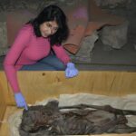 Prof Sahar Saleem with the Screaming Woman mummy. Credits: Sahar Saleem, CC BY