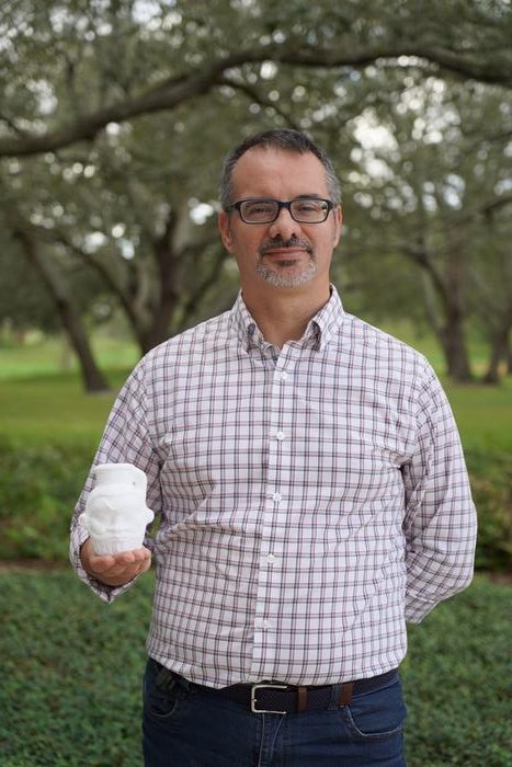 University of South Florida scholar Davide Tanasi holds a 3D-generated replica of the Egyptian Bes mug. Credits: Cassidy Delamarter