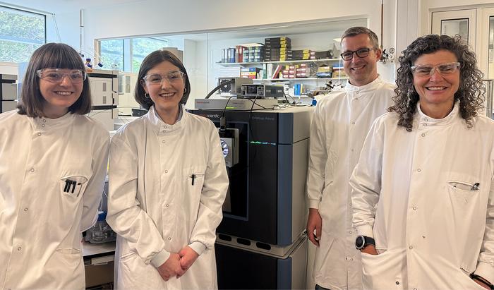 Authors of the study (left to right: Dr. Sarah Flannery, Alexandra Morton-Hayward, Prof. Roman Fischer, and Dr. Iolanda Vendrell) in the Mass Spectrometry Lab at the Centre for Medicines Discovery, Nuffield Department of Medicine, University of Oxford. Image credits: Roman Fischer