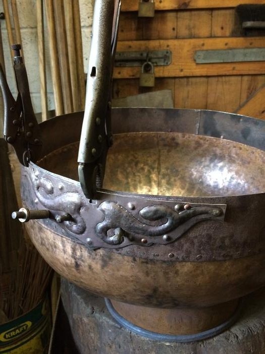 Fitting the mount plates to the cauldron wall. Photo Credits: University of Leicester